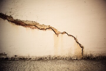 Poster - Gray cement texture covers a cracked concrete wall that is used as the background
