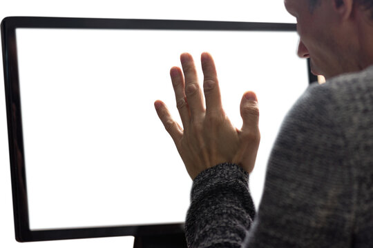 Back view of worried young man using computer with empty screen for copy space. Man at computer, back close-up, white screen, perfect for text or graphics
