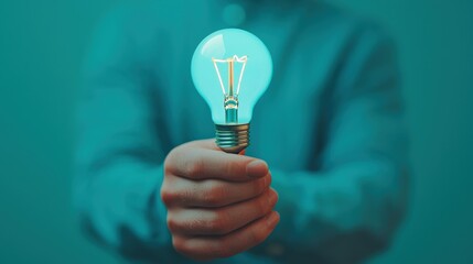 Aufkleber - Professional holding glowing lightbulb: innovative vision and inspiration
