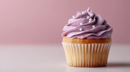 Aufkleber - Close-up of a vanilla cupcake decorated with lavender frosting and tiny sugar pearls, set against a soft pink background, perfect for celebrations and desserts