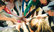 © Jacob Lund - Group of runners uniting in a team huddle before marathon