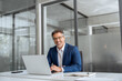 © Stock 4 You - Smiling portrait senior businessman professional entrepreneur working at desk on financial work, looking at camera. Mature Latin business man ceo manager using laptop computer in office. Copy space