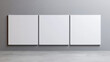 © Tichila - Three square blank picture canvases on grey wall. Template for your content. 3D illustration.