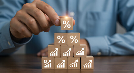 Aufkleber - Hand Stacking Wooden Blocks with Percentage Signs and Growth Charts on Brown Table Showing Financial Growth