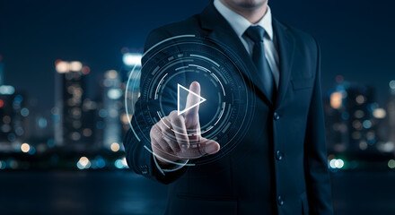 Poster - Professional Businessman in Dark Suit Touching Digital Play Button Overlayed Against Night Cityscape