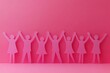 © Imagentive - Pink Paper Cutout Women Celebrating Togetherness
