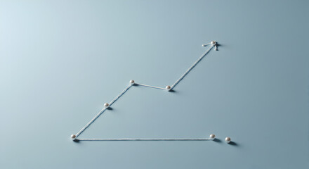 Poster - Simple Business Graph with Silver Pins on Pale Blue Background Represents Growth