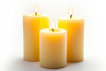 Poster - Three lit candles of varying heights standing on a white surface creating a warm and inviting glow