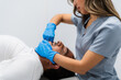 © pablo - Female physiotherapist wearing gloves performing jaw rehabilitation therapy on male patient