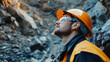 © Mcgui - Miner in Safety Gear Looking Upwards