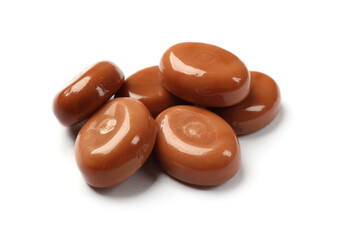 Wall Mural - Tasty sweet caramel candies isolated on white