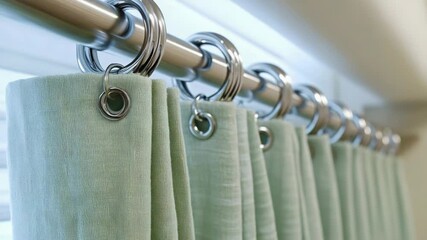 Poster - A detailed view of a curtain with metal rings, useful for interior design and decoration purposes