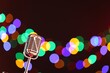 © New Africa - Vintage microphone on dark background with blurred lights, space for text. Musical equipment