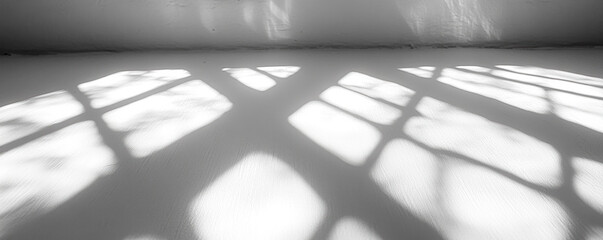 Poster - A window with a white frame and a white background. The window is letting in light, creating a shadow on the floor