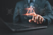 © Nirusmee - Businessman with laptop with data information privacy and document management hacking and spam warning symbol. cyber attack network, virus, spyware, Cyber security and cybercrime.