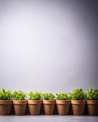 Poster - Lush row of potted green plants neatly arranged to enrich indoor spaces with natural beauty