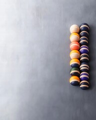 Poster - Vibrant stack of colorful wooden balls displayed artistically on a light background in playful arrangement