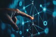© multasam - A hand interacts with a complex network of glowing connections  A fingertip touches a central point within a network of lines and dots, suggesting digital interaction, connections, and data flow