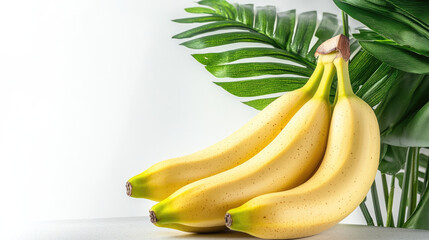 Poster - Fresh yellow banana fruit with green leaf on white background, healthy tropical food, natural and vibrant, perfect for summer and wellness concepts