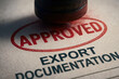 © newlifestock - Approved stamp on export documentation shows trade flow and globalization impact on international business approval process