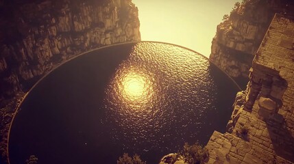 Poster - Captivating river flowing through a stunning landscape with the sun glimmering in the center creating a magical atmosphere