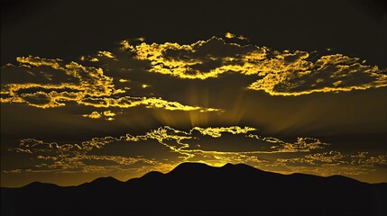 Poster - Stunning sunset with a majestic mountain silhouette in the background bathed in warm golden light creating a captivating scene