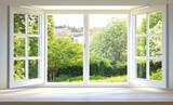 Wide, white, windowed view of a sunny garden  A light wooden sill frames the view, showcasing lush greenery and buildings beyond