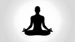 © Adeel - Silhouette of a person in lotus position meditating against a white gradient background in a studio