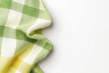 Leinwandbilder - A vibrant green and white checkered cloth napkin, draped over a white surface  Its soft folds create a gentle texture, highlighting the pattern
