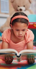 Poster - Kid, education or girl reading book in school for support, development or learning growth in library. Language, knowledge and female child with story for literature lesson, fairy tale and fantasy