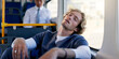 © peopleimages.com - Nurse, public transportation and sleeping with man on bus for commute or travel to healthcare job. Burnout, fatigue and scrubs with tired medical professional in hospital vehicle for journey to work
