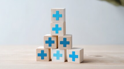 Poster - Wooden block tower with blue cross on top illustrating cross-border humanitarian finance and investment icon concepts