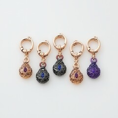 Poster - Collection of three distinct colored stone charms displayed together on a simple background
