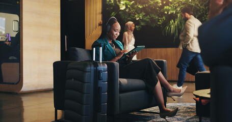 Aufkleber - Business woman, headphones and tablet in lobby for planning, research or travel for seminar. Chair, music or streaming with happy flight passenger in hotel with luggage or suitcase for job trip