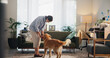 © peopleimages.com - Love, care and dog with woman living room for petting, bonding and loyalty. Trust, animal adoption and relax with female person and golden retriever at home for support, domestic and happiness