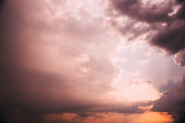 Wall Mural - Sunset Copy Space Sunset Cloudy Sky With Evening Clouds Natural Background Dramatic Sky. Yellow, Orange, Pink, Magenta Colors.
