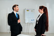 © kinomaster - Business Professionals Having a Discussion in an Office Setting