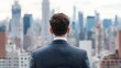 © pkproject - Ambitious entrepreneur gazes upon city skyline, symbolizing career