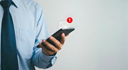 businessman checking smartphone with new email notification icon on light gray background – concept 