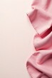 © BokehBox - Soft Pink Fabric Draped on a Pale Pink Background with Delicate Edging