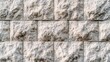 © PB Studio - decorative stone cladding wall with uniform rectangular tiles in beige and gray tones, showing clean alignment and contemporary style modern stone cladding, rectangular tiles, clean lines, neutral