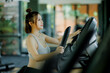 © Wanchai - 'Driven by passion and positivity, she runs with a smile on a cardio machine, embracing every moment of her fitness routine.