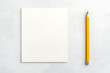© A2Z AI  - Blank page and yellow pencil on clean surface, ready for ideas, sketching, or notes. Workspace with potential for creativity or productivity.