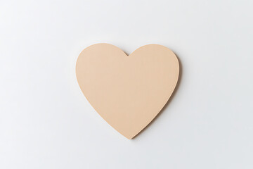 Fototapete - Beige heart isolated on a bright white backdrop. Simple, elegant, and minimalist in design. Evokes sentiments of love, warmth, and tenderness.