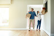 © peopleimages.com - Boxes, moving and couple in new home for property ownership, relocation and investment. Cardboard, love and people with packages for buying real estate together in marriage for commitment at house.
