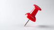 © SDArts - Red pushpin with realistic metallic tip, Shiny plastic head with natural light, Desktop or bulletin board accessory, Isolated on a transparent background