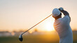 © ALSADRA - Rear view of golfer swinging club with dynamic motion against sunrise horizon, ideal for sports branding, golf tournaments and active lifestyle content