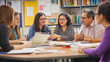 © SirArbusto - Collaborative Learning: A diverse group of teachers or students engaged in a lively discussion around a circular table, actively participating in collaborative learning.