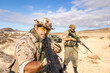 © ADDICTIVE STOCK - Military Training in Desert Terrain with Tactical Team Ready
