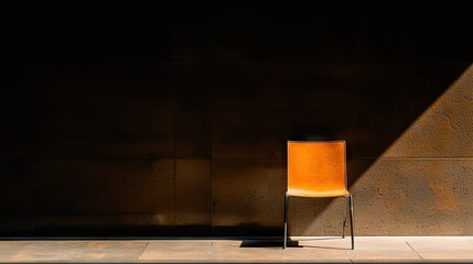 Poster - An empty orange chair against a textured wall in sunlight